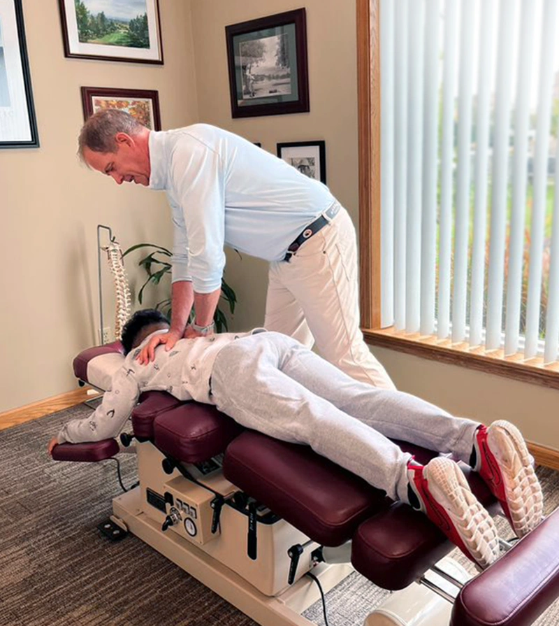 Chiropractor Gahanna OH Bruce Aldrich Adjusting Patient